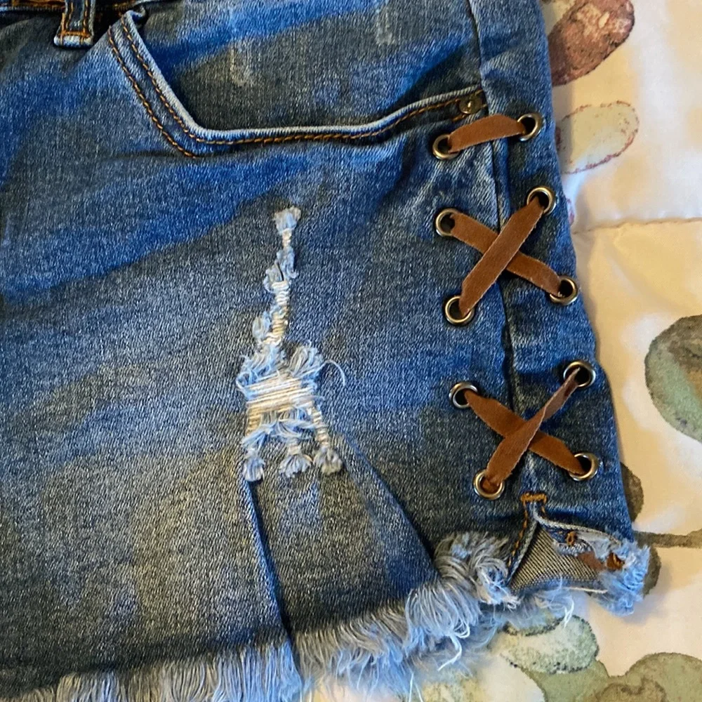 Lace up stretchy jean shorts. - Picture 2 of 5